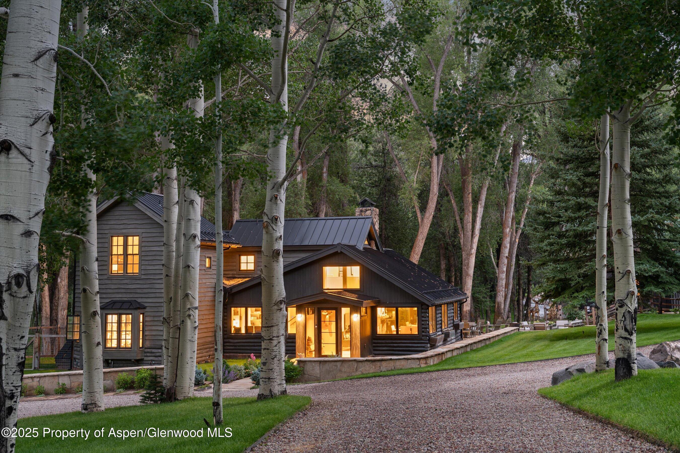 6458 Snowmass Creek Road Snowmass, CO 81654 - Photo 3 of 114 a front view of a house with a yard