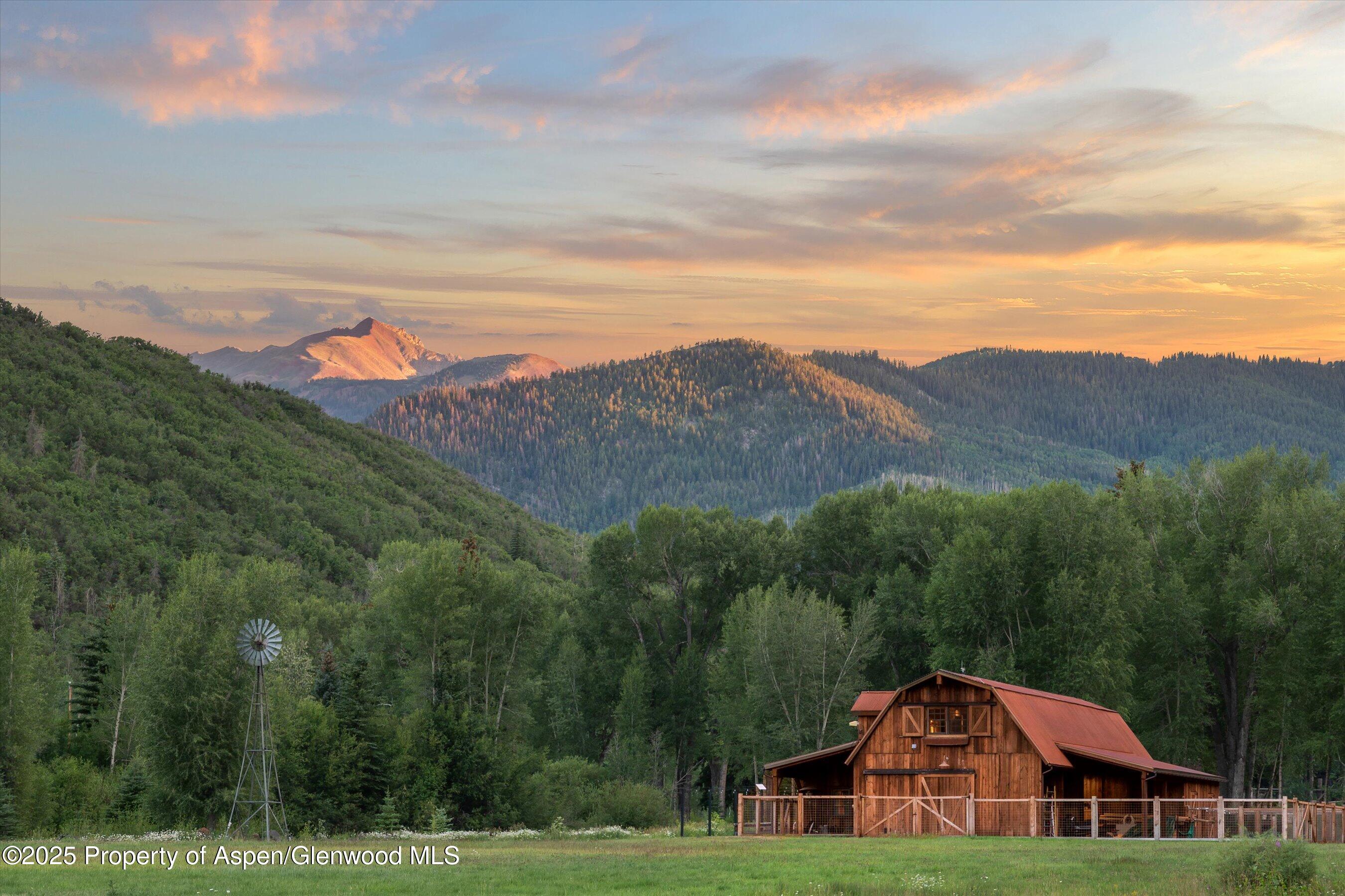 6458 Snowmass Creek Road Snowmass, CO 81654 - Photo 65 of 114 a front view of a house with a big yard