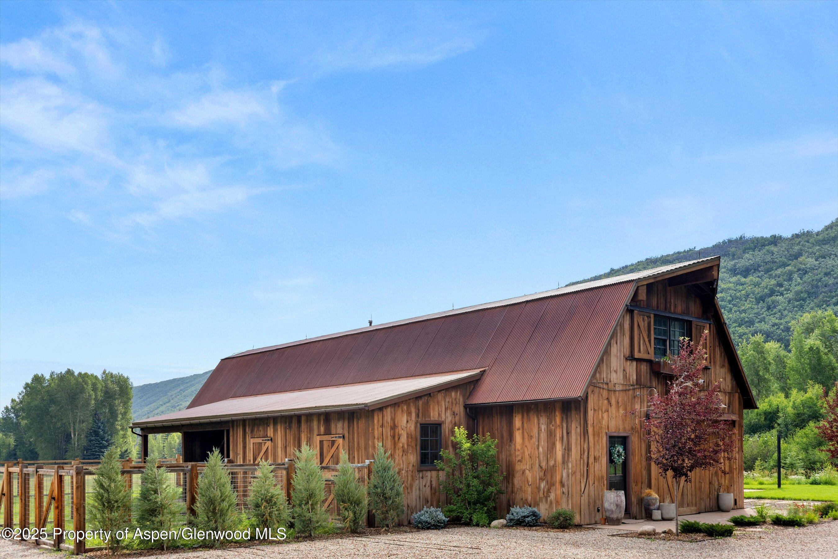 6458 Snowmass Creek Road Snowmass, CO 81654 - Photo 72 of 114 a front view of a house with a yard