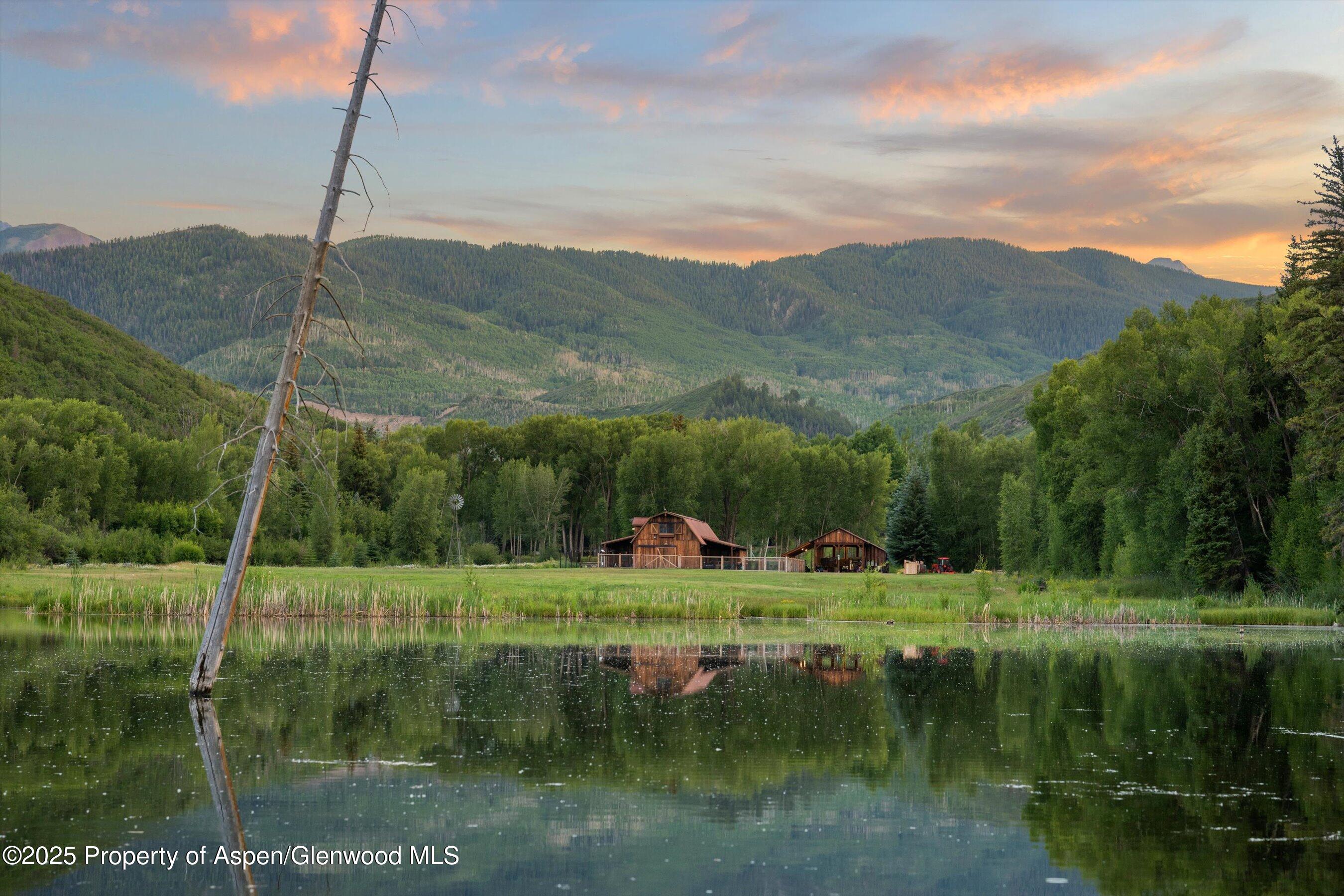 6458 Snowmass Creek Road Snowmass, CO 81654 - Photo 75 of 114 a view of a lake with a mountain in the background