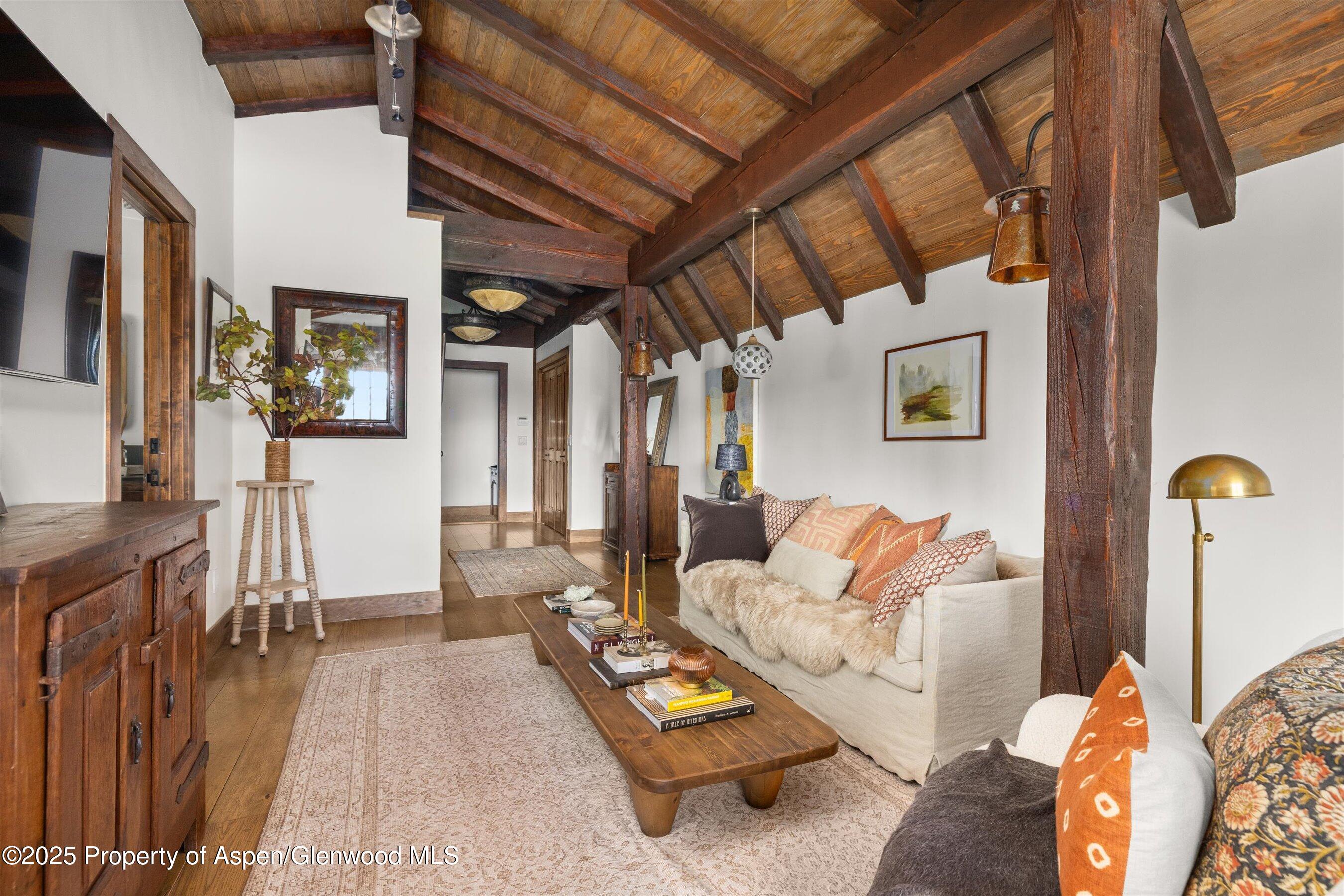 6458 Snowmass Creek Road Snowmass, CO 81654 - Photo 78 of 114 a living room with furniture and a wooden floor
