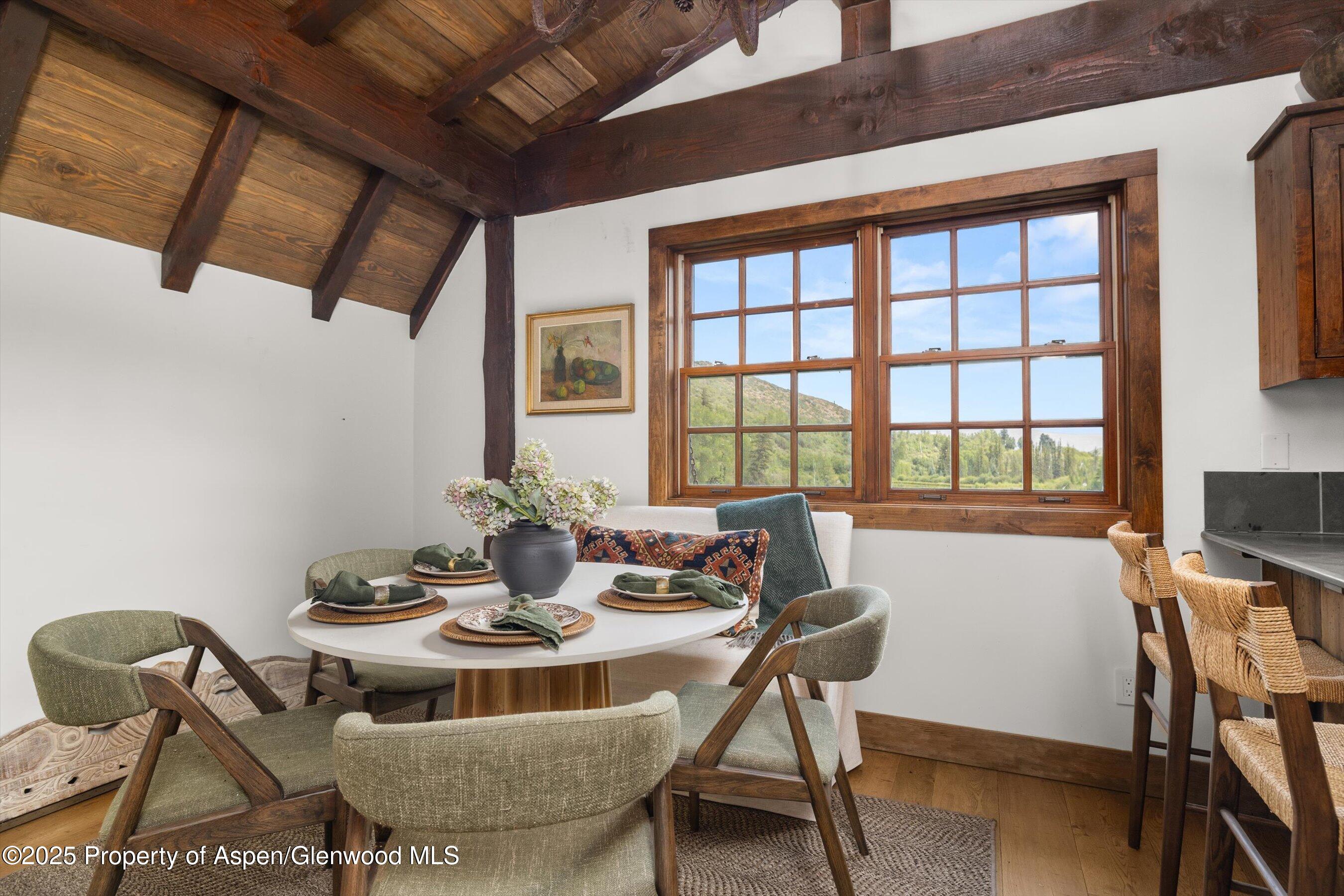 6458 Snowmass Creek Road Snowmass, CO 81654 - Photo 79 of 114 a view of a dining room with furniture window and outside view