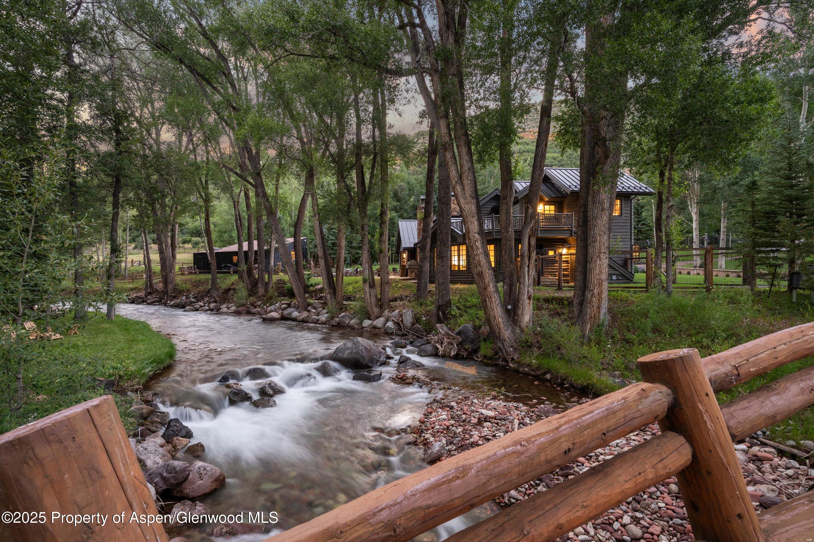 6458 Snowmass Creek Road Snowmass, CO 81654 - Photo 8 of 114 a view of a backyard with sitting area