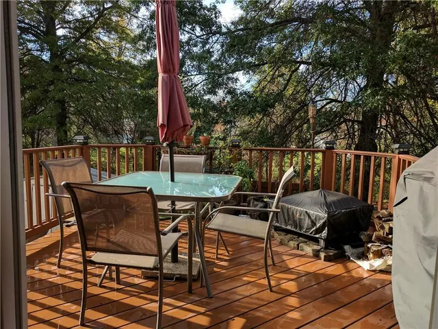 a view of a chairs and table in the patio