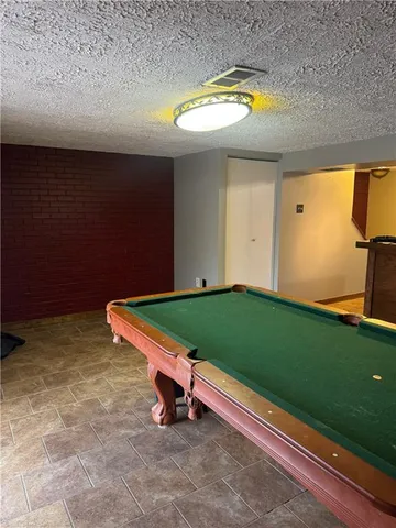 a view of a swimming pool with a yard