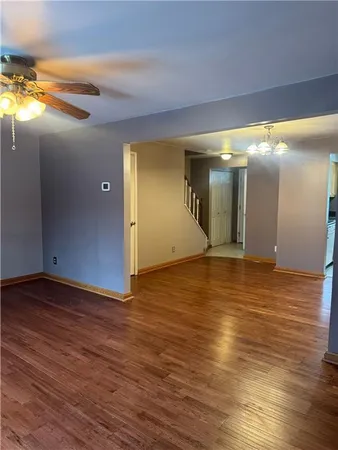 a view of a hallway with a room