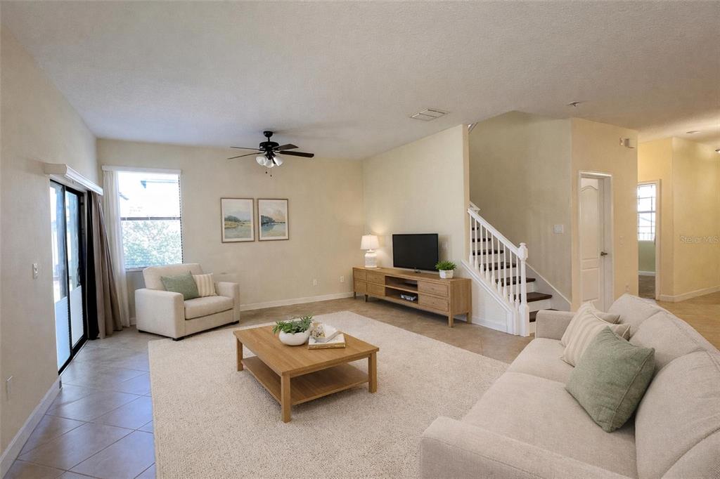 15401 Porter Road Winter Garden, FL 34787 - Photo 11 of 59 a living room with furniture and a flat screen tv