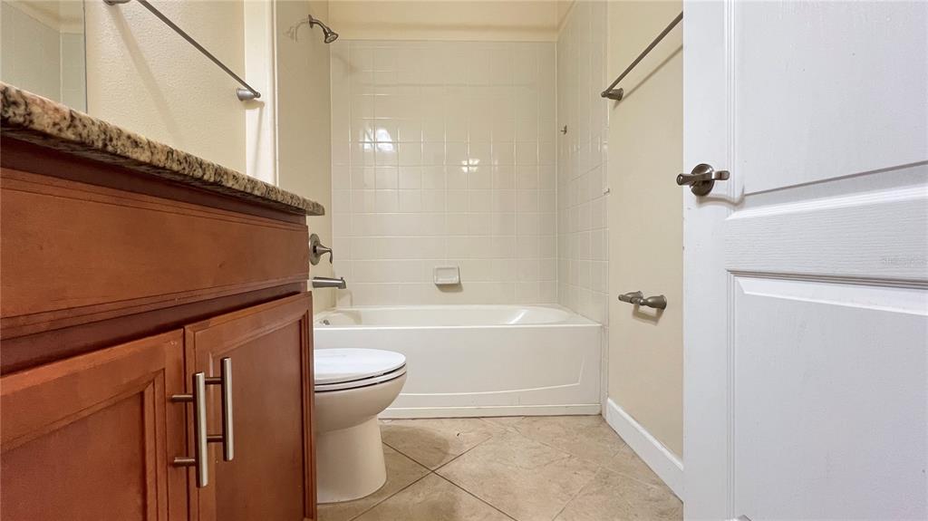 15401 Porter Road Winter Garden, FL 34787 - Photo 26 of 59 a bathroom with a sink a toilet and a bathtub