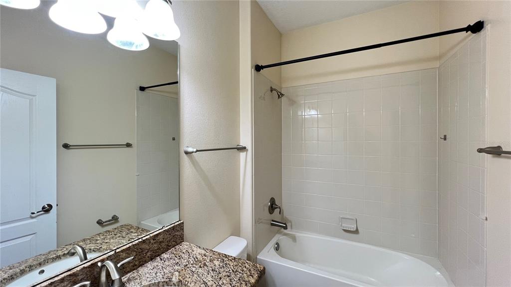 15401 Porter Road Winter Garden, FL 34787 - Photo 27 of 59 a bathroom with a tub shower sink and vanity