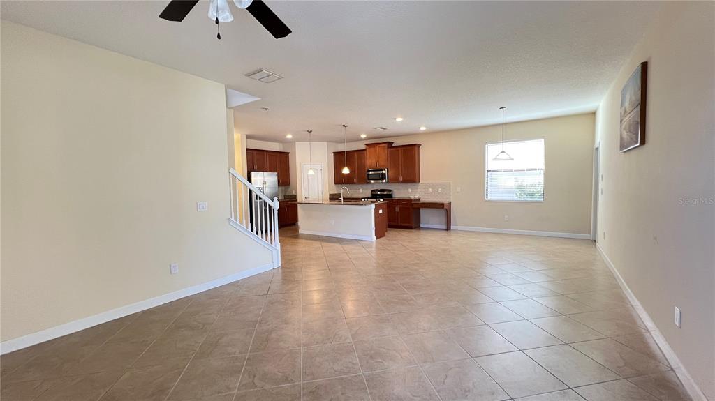 15401 Porter Road Winter Garden, FL 34787 - Photo 34 of 59 a view of a livingroom with furniture and a ceiling fan