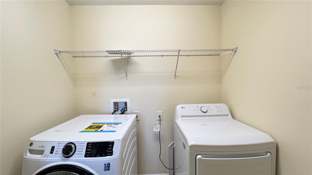 15401 Porter Road Winter Garden, FL 34787 - Photo 46 of 59 a utility room with dryer and washer