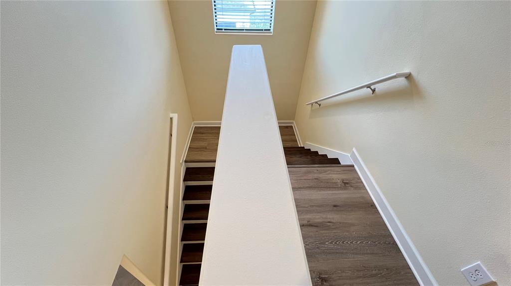 15401 Porter Road Winter Garden, FL 34787 - Photo 48 of 59 a view of a staircase with white walls and a window