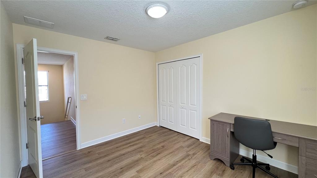 15401 Porter Road Winter Garden, FL 34787 - Photo 50 of 59 a view of a workspace with wooden floor and a workspace