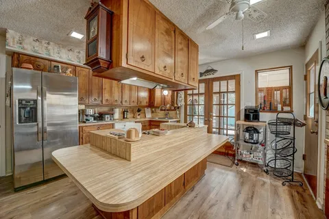 a kitchen with a sink cabinets and window