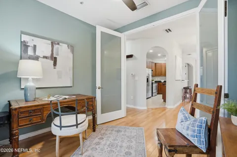 a bedroom with furniture and a wooden floor