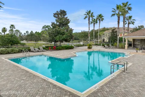 swimming pool view with a outdoor seating space