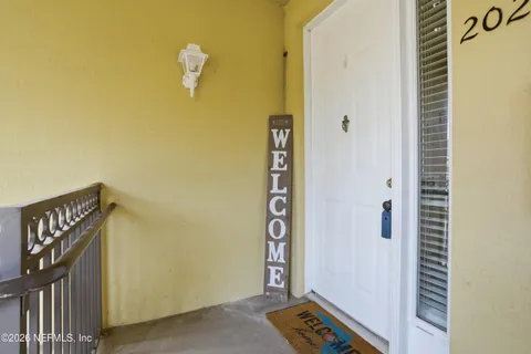 a view of an entryway with wooden floor