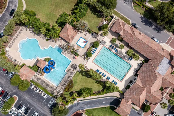 an aerial view of a house a yard and street