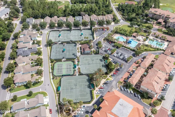 an aerial view of residential houses with outdoor space