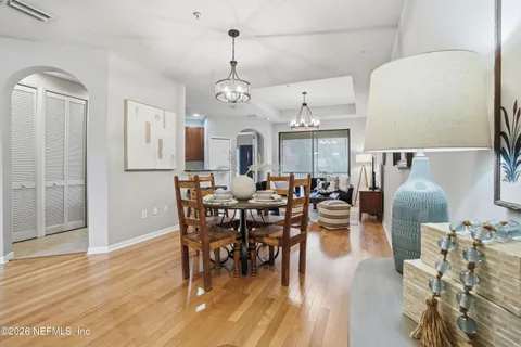 a view of a dining room with furniture and wooden floor