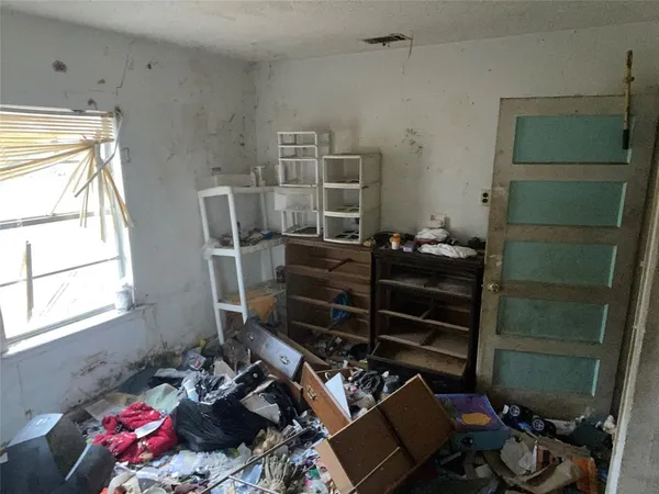 a room with a closet and a window