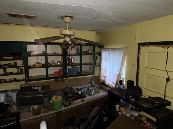 a kitchen with a stove and a refrigerator