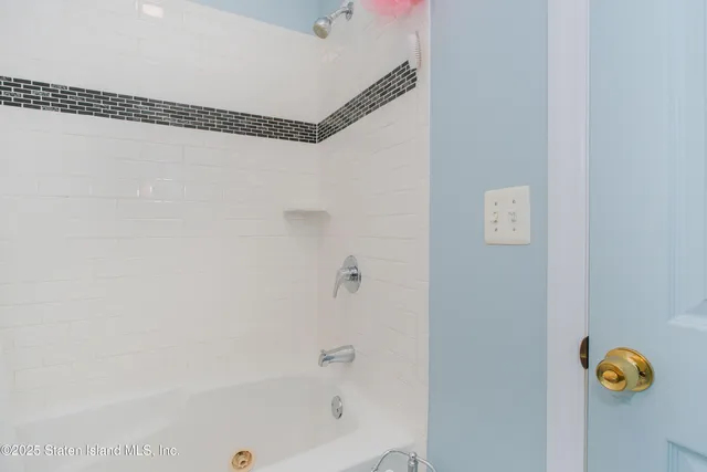 a bathroom with a sink mirror and toilet