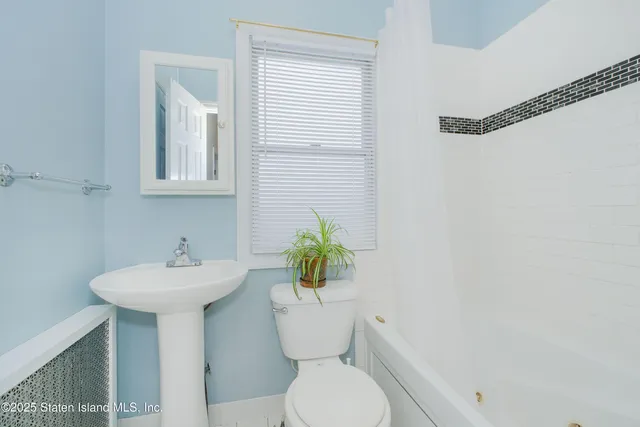 a bedroom with furniture and a chandelier