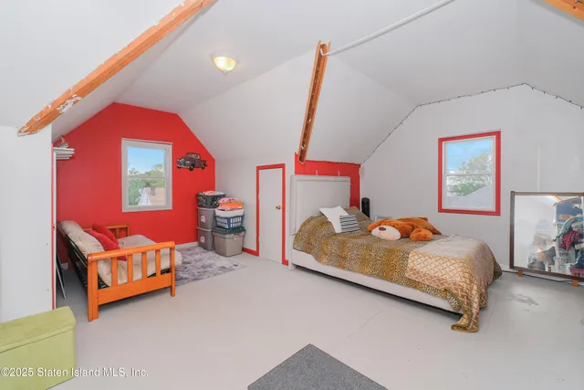 a living room with furniture a rug and a large window