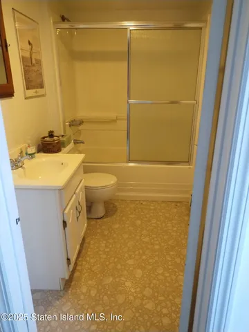 a bathroom with a sink a washer and dryer