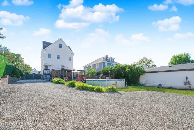 a view of an house with backyard space and garden