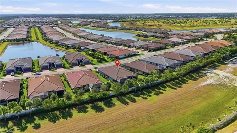 an aerial view of residential building and lake