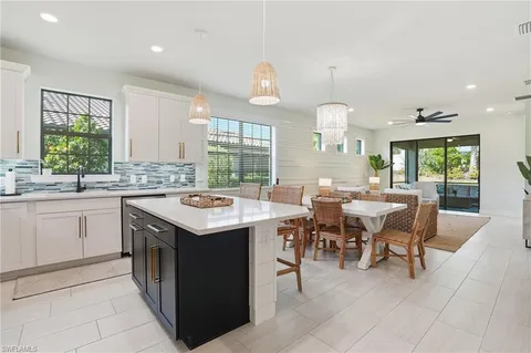 a kitchen with a stove a sink a counter top space and appliances
