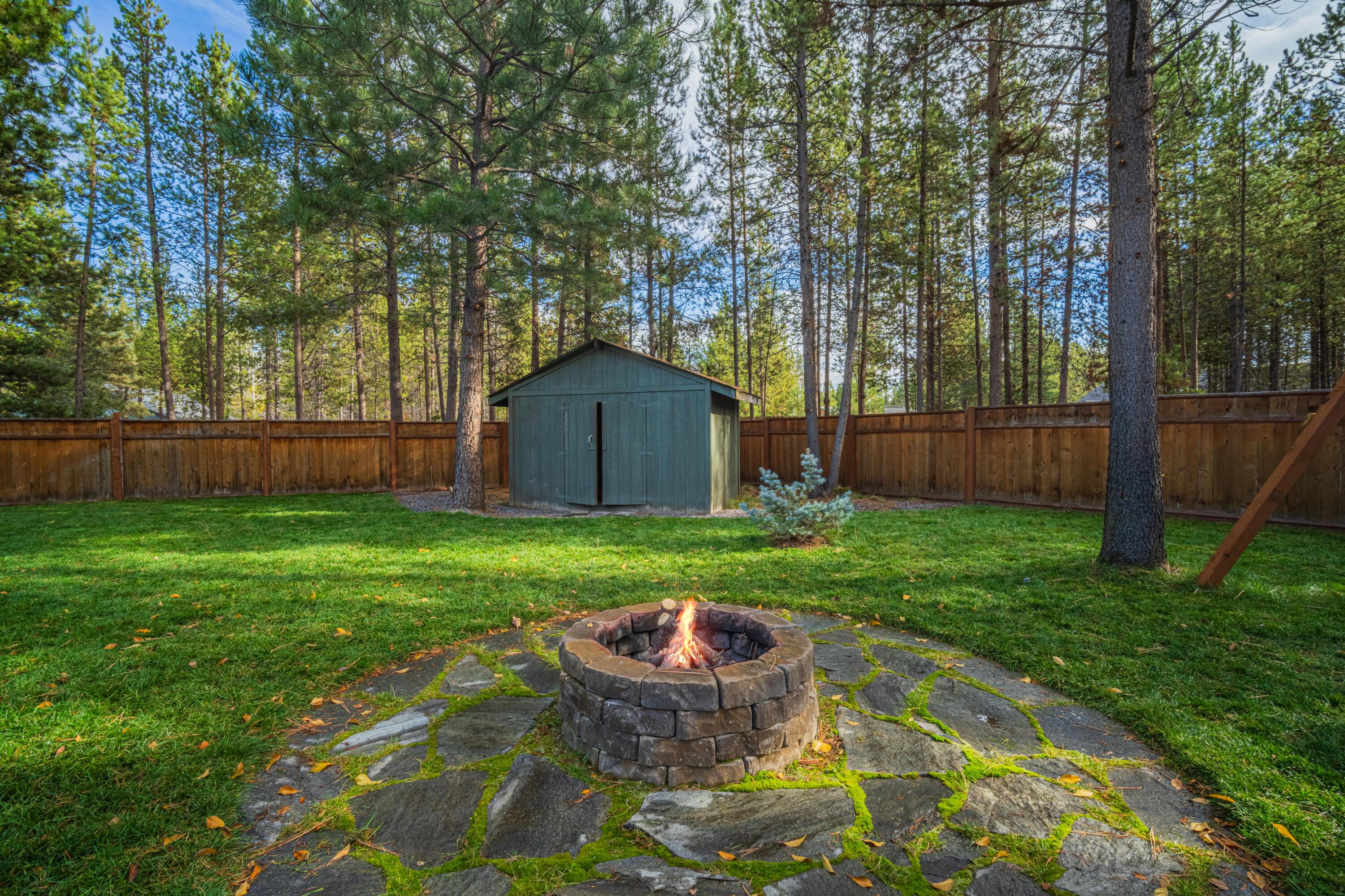 56078 Snow Goose Road Bend, OR 97707 - Photo 32 of 46 Backyard with a firepit.