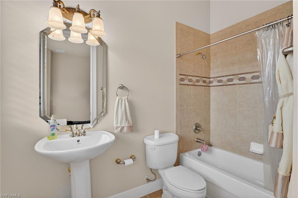 1964 Rialto Way Alva, FL 33920 - Photo 29 of 50 a bathroom with a sink toilet and shower