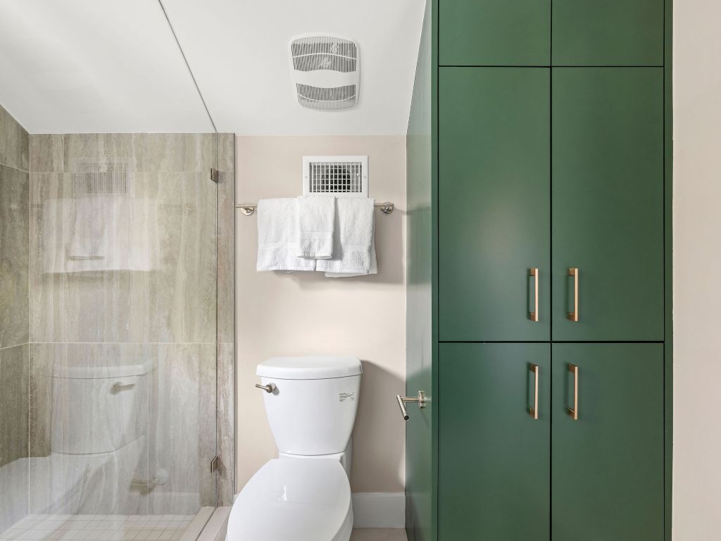 1401 East 3rd Street, Unit 2 Austin, TX 78702 - Photo 19 of 31 Full bathroom with a stall shower and toilet