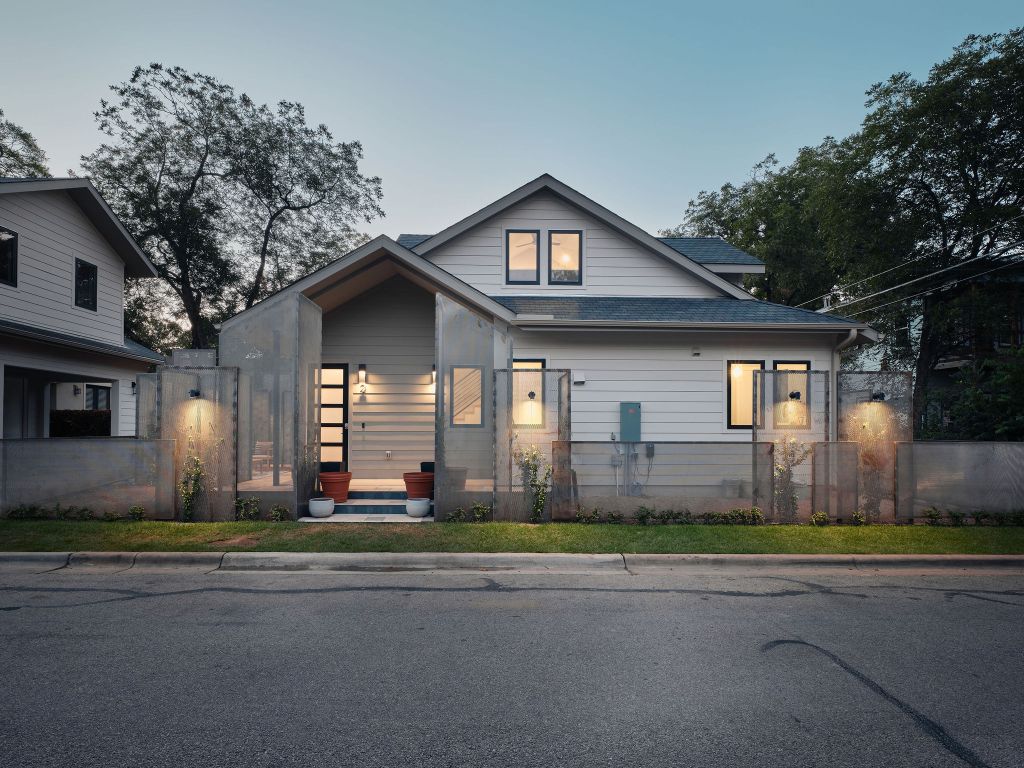 1401 East 3rd Street, Unit 2 Austin, TX 78702 - Photo 2 of 31 View of front of home featuring a fenced front yard and a shingled roof