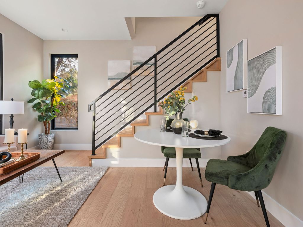 1401 East 3rd Street, Unit 2 Austin, TX 78702 - Photo 23 of 31 Foyer entrance with stairs and light wood-type flooring