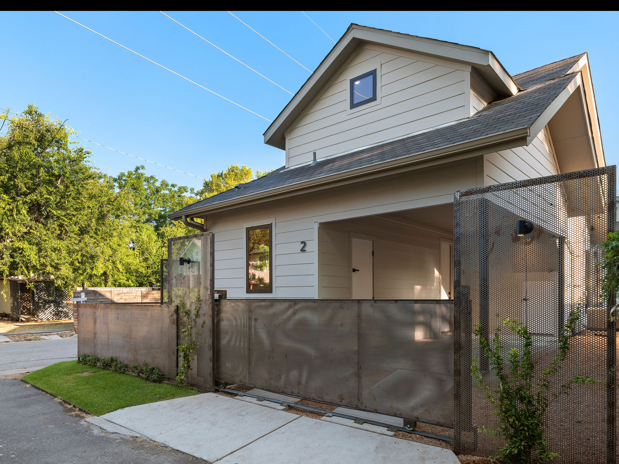 1401 East 3rd Street, Unit 2 Austin, TX 78702 - Photo 30 of 31 View of front facade featuring a shingled roof