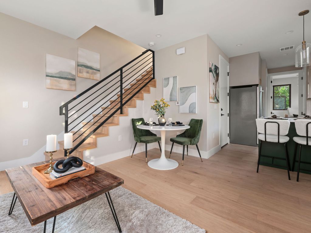 1401 East 3rd Street, Unit 2 Austin, TX 78702 - Photo 8 of 31 Living room featuring light wood finished floors and stairway
