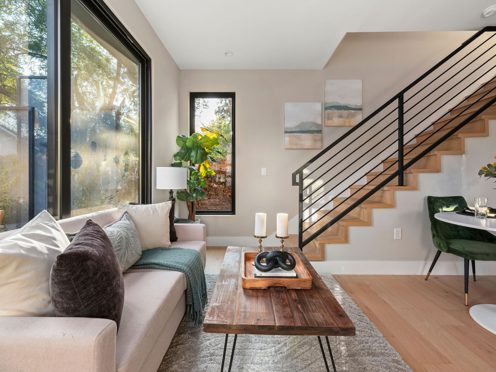 1401 East 3rd Street, Unit 2 Austin, TX 78702 - Photo 9 of 31 Living room with wood finished floors and stairway