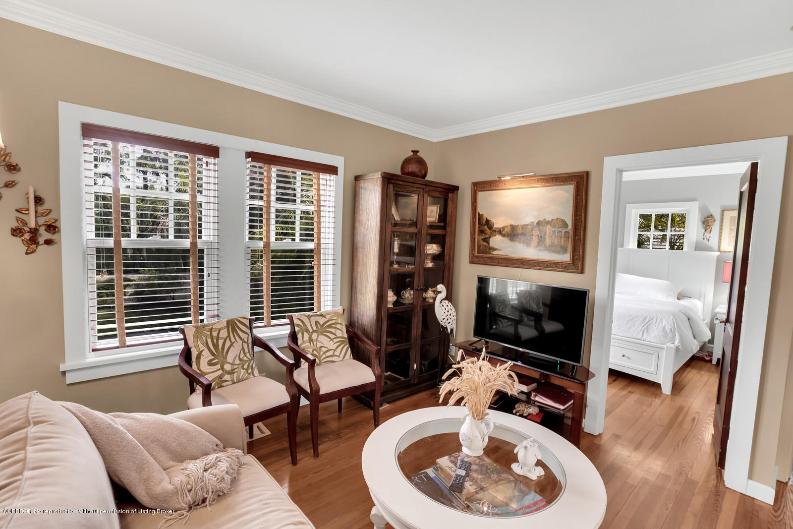 258 Wells Road Palm Beach, FL 33480 - Photo 17 of 18 a living room with furniture a flat screen tv and a large window