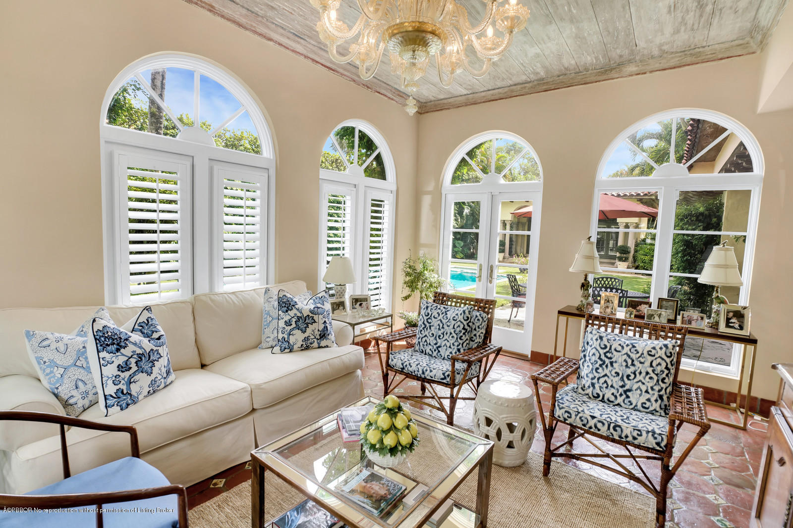 258 Wells Road Palm Beach, FL 33480 - Photo 5 of 18 a living room with couches a table and a chandelier