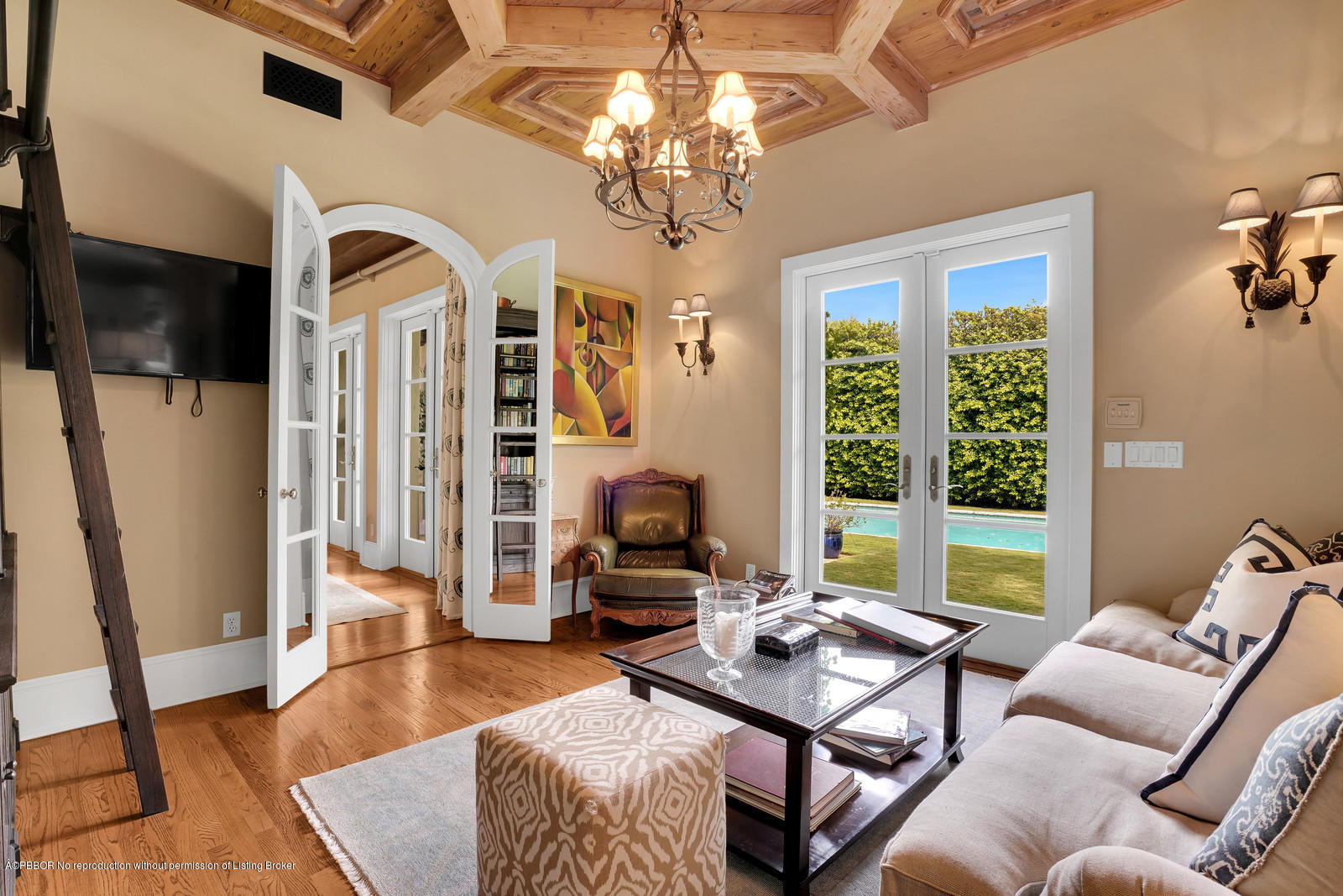 258 Wells Road Palm Beach, FL 33480 - Photo 7 of 18 a living room with furniture a chandelier and a table
