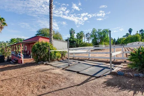 a view of a yard with cars