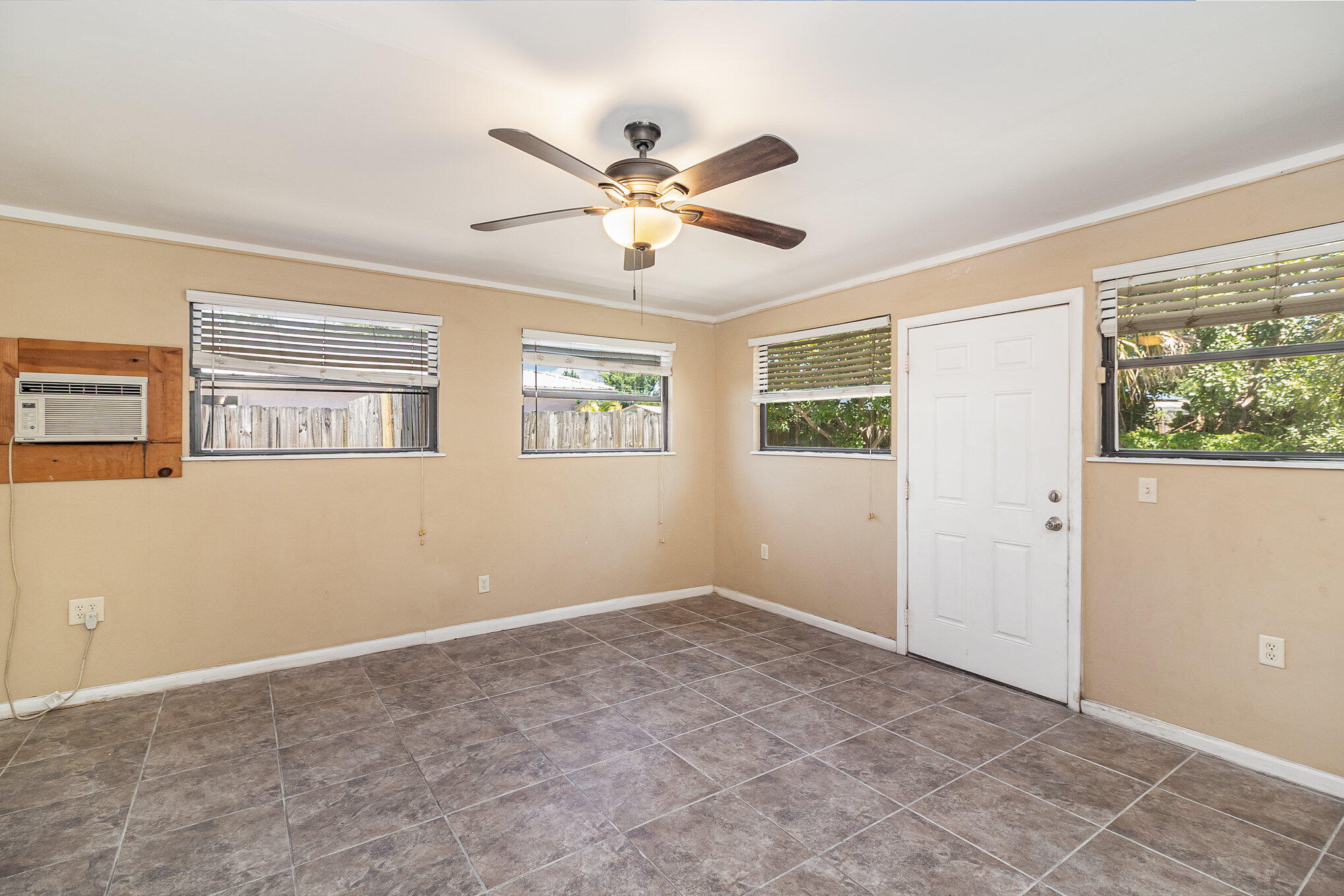 635 Croton Road Melbourne, FL 32935 - Photo 21 of 22 a view of a livingroom with a ceiling fan and window