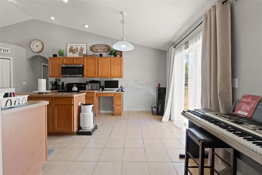 15335 Fleetwood Road Weeki Wachee, FL 34614 - Photo 20 of 40 a kitchen with stainless steel appliances granite countertop a stove top oven a sink a counter top space and cabinets