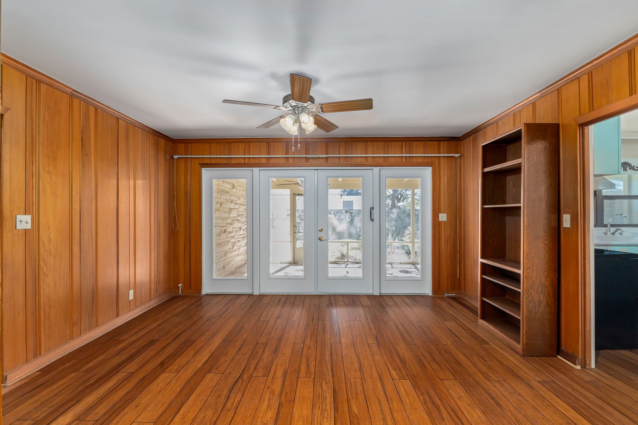 301 Bonham Street Columbus, TX 78934 - Photo 20 of 44 wooden floor in an empty room with a window