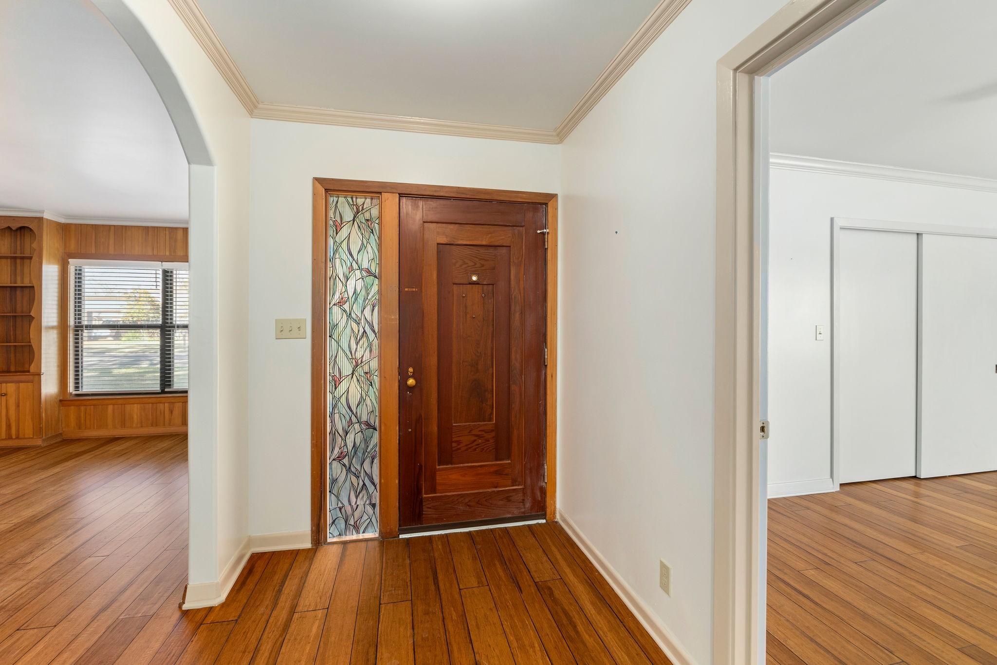 301 Bonham Street Columbus, TX 78934 - Photo 22 of 44 a view of a hallway with wooden floor
