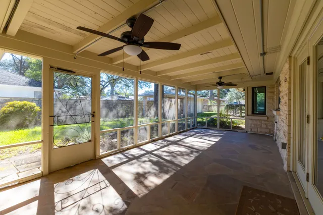 a view of backyard with a large window